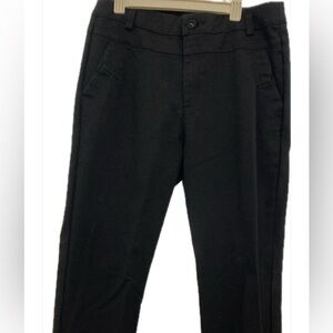 Black fitted straight leg pants.